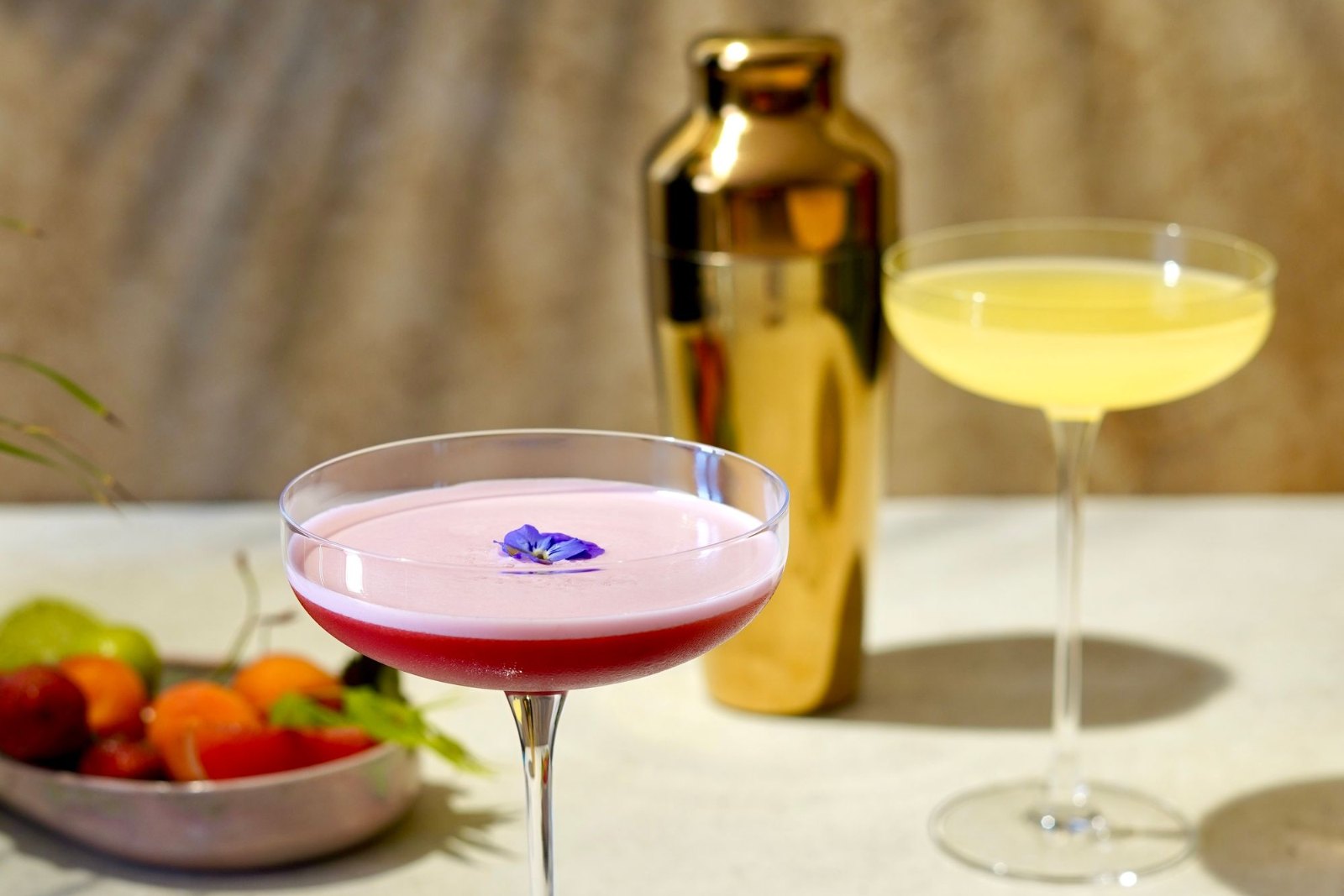 Cocktails on a low table in a dim bar